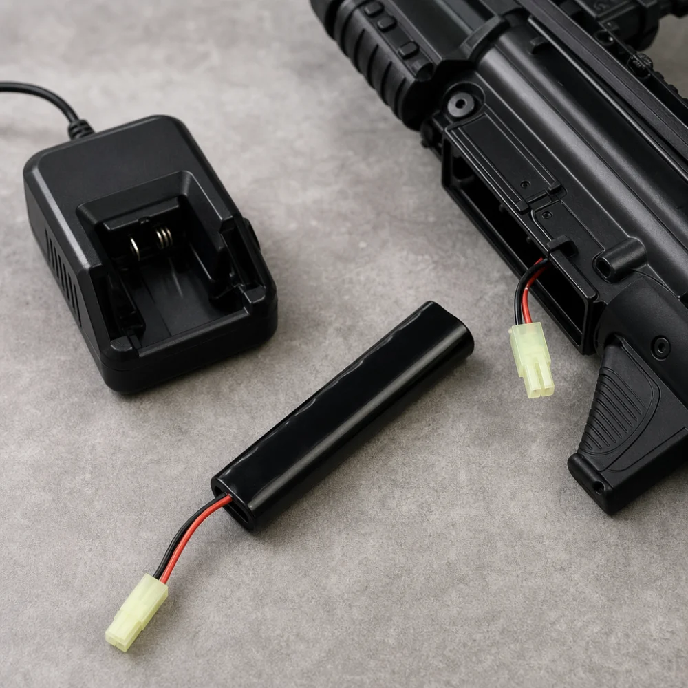 Generic airsoft battery and charger laid out for comparison