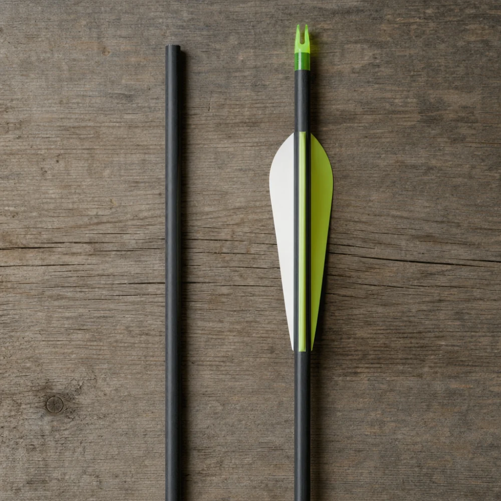 Bare arrow shaft beside a finished carbon arrow