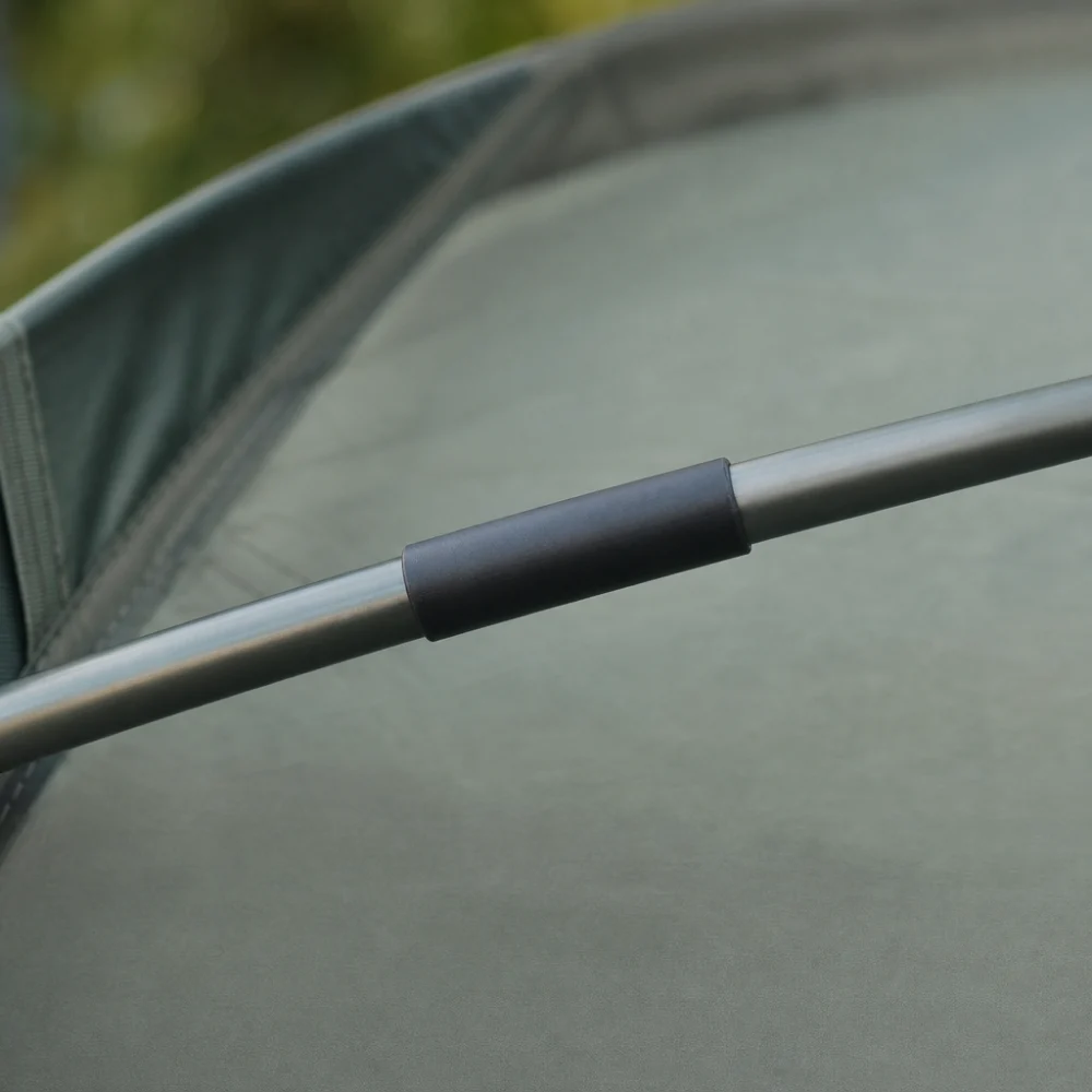 Repair sleeve aligned over a tent pole break area.